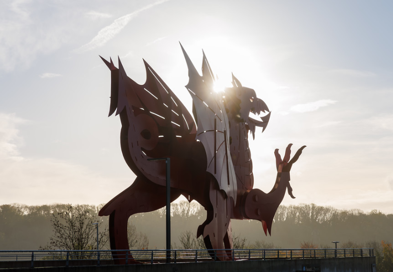 A photo of the iconic red dragon statue outside the International Convention Centre, Wales